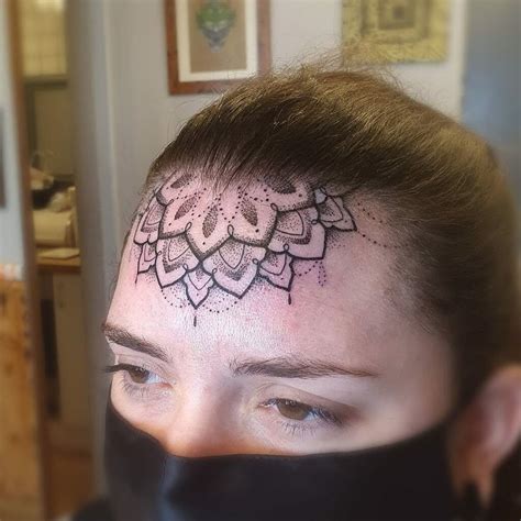 Discover the Mesmerizing Beauty of Mandala Forehead Tattoo Designs